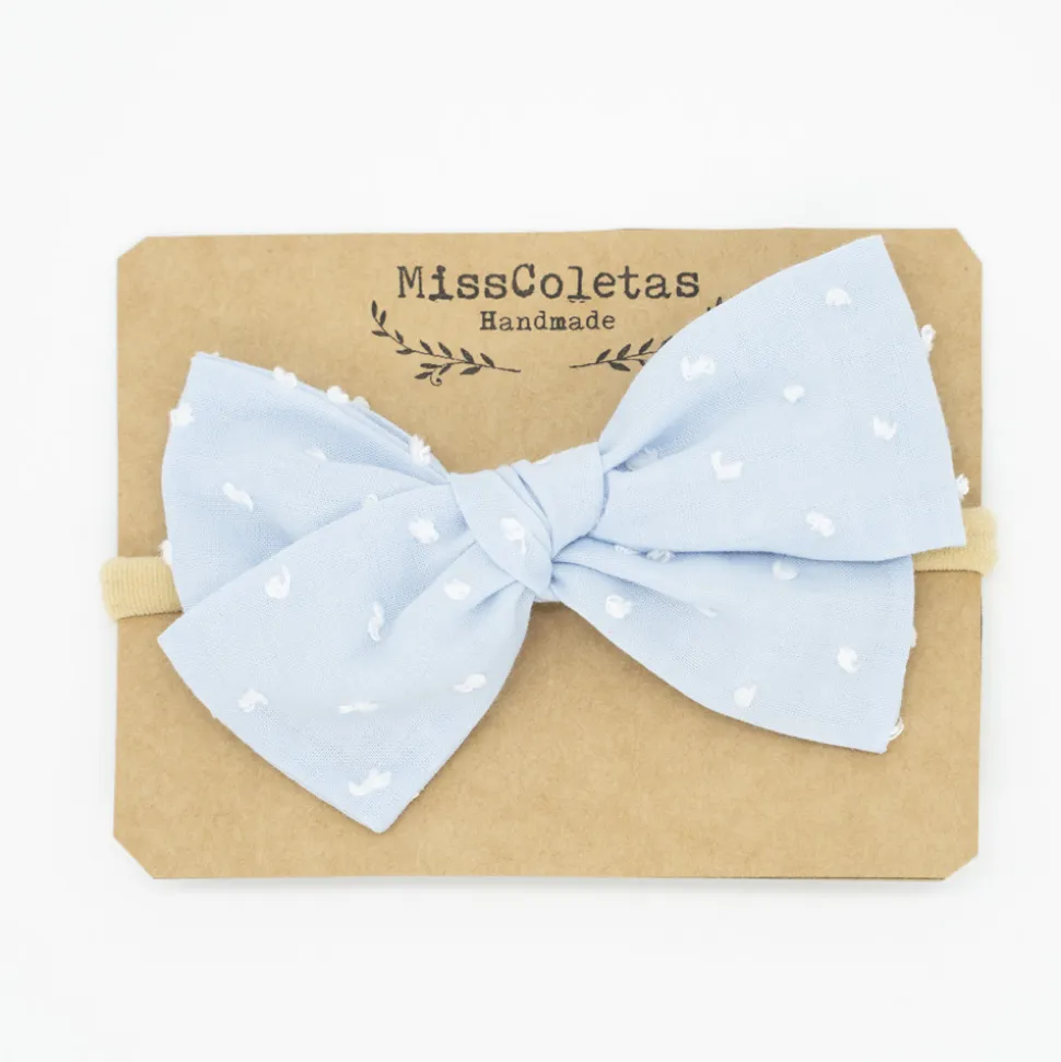 Diadema bebé lazo azul celeste plumeti