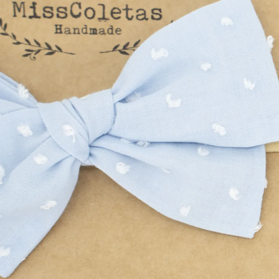 Diadema bebé lazo azul celeste plumeti