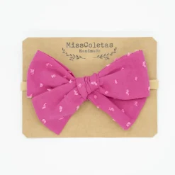 Diadema bebé lazo fucsia plumeti