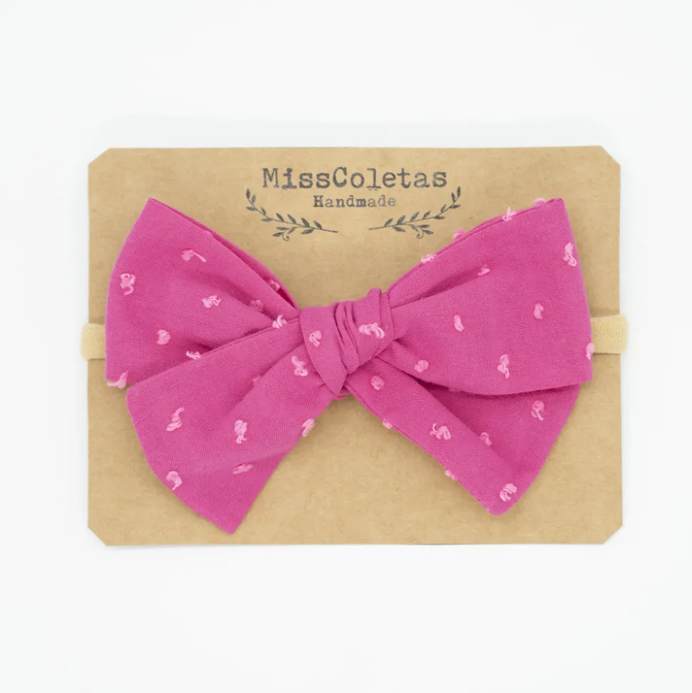 Diadema bebé lazo fucsia plumeti