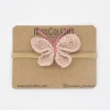 Diadema bebé mariposa crochet rosa nude