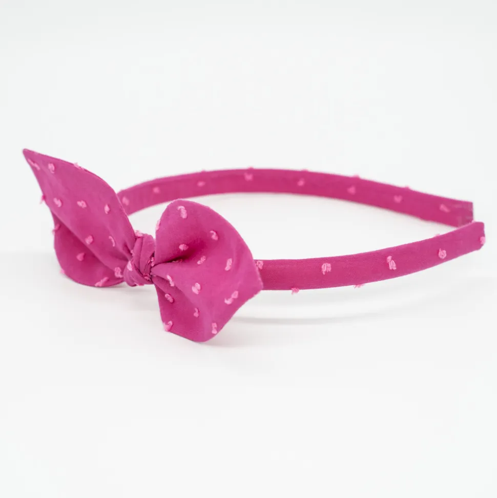 Diadema lazo fucsia plumeti hecha a mano