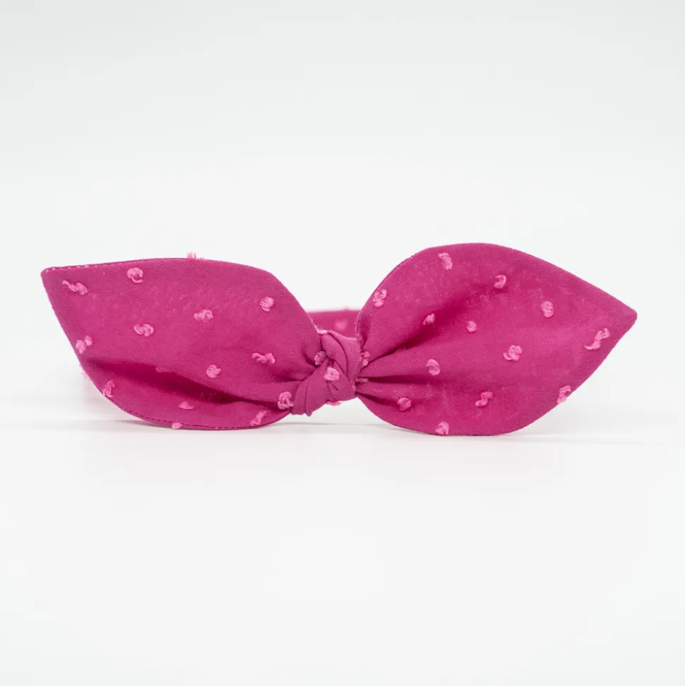 Diadema lazo fucsia plumeti hecha a mano