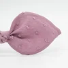 Diadema lazo malva rosa plumeti hecha a mano
