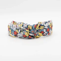 Diadema nudo flores azul marino hecha a mano