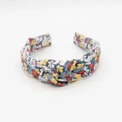Diadema nudo flores azul marino hecha a mano