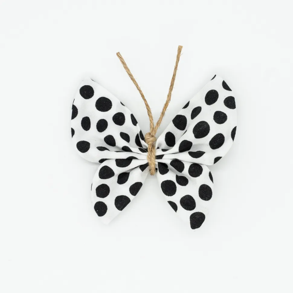 Pinza mariposa blanca topos negros