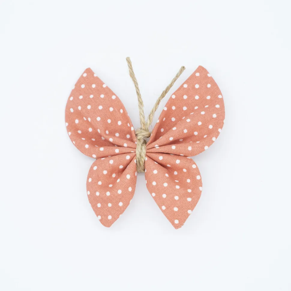 Pinza mariposa rosa topos